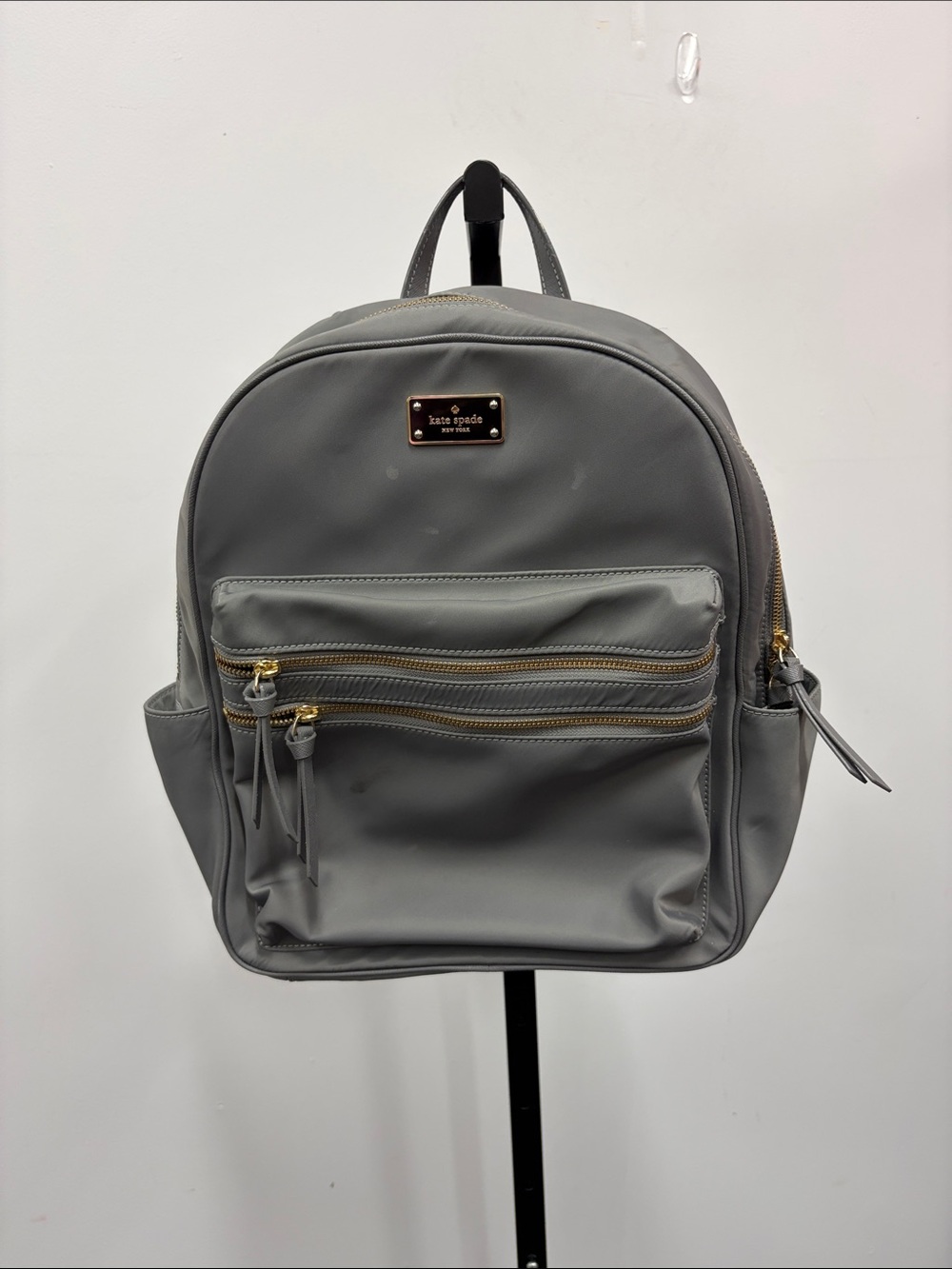 kate spade gray nylon backpack with gold accents